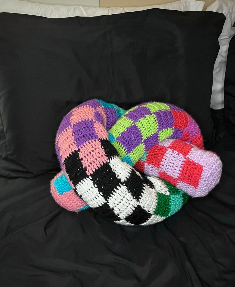 Crochet checkered knot pillow